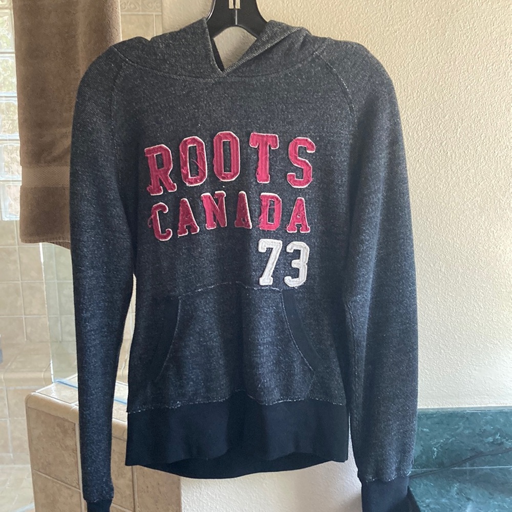 Roots,medium fits more like a small. Black very sm white dots in material